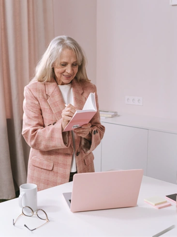 woman looking at notebook